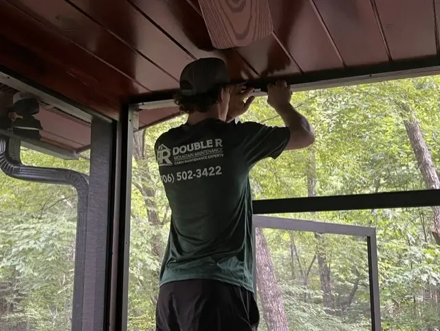Installing new fiberglass screen and spline on a cabin porch in Blue Ridge, GA