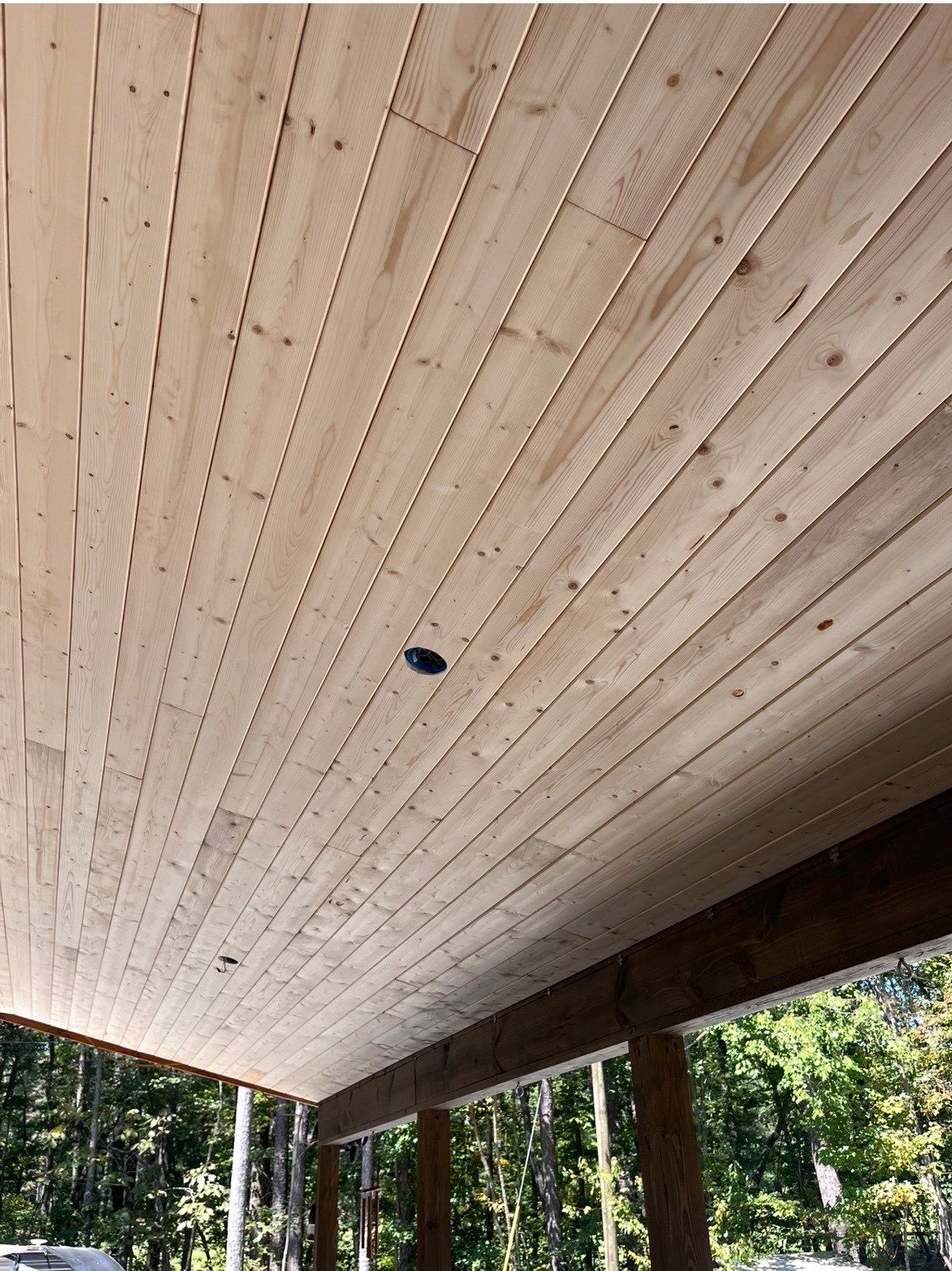 Newly installed unstained tongue and groove pine porch ceiling in Talking Rock, GA